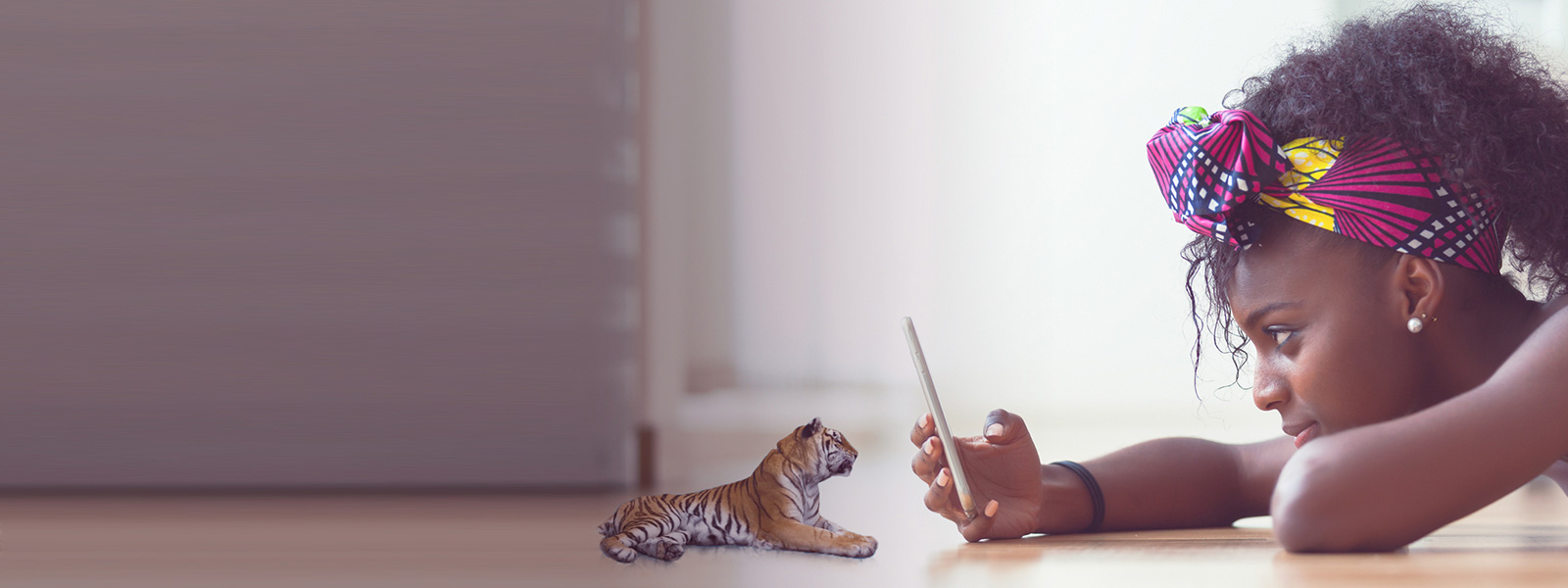 Girl playing with AR tiger
